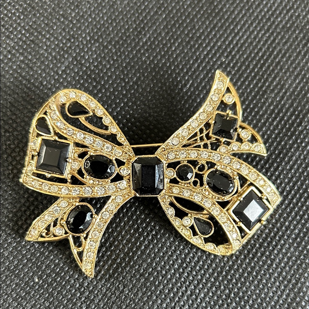 Elegant Gold and Black Bow Brooch